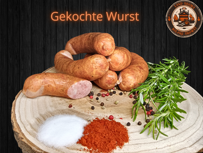 Box 10 kg – „Königliche Box” with a variety of traditional Polish sausages displayed on a wooden board with spices.