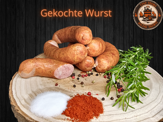 Box 10 kg – „Königliche Box” with a variety of traditional Polish sausages displayed on a wooden board with spices.